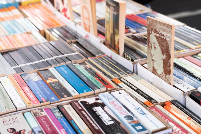 Melbourne Book Market at Queen Victoria Market, rows of tightly packed books. A Room of One's Own by Virginia Woolf is in the foreground.