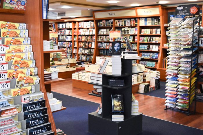 Interior of Alexandra bookshop showing a variety of different displays, some selling magazines, others selling paper and other stationery.