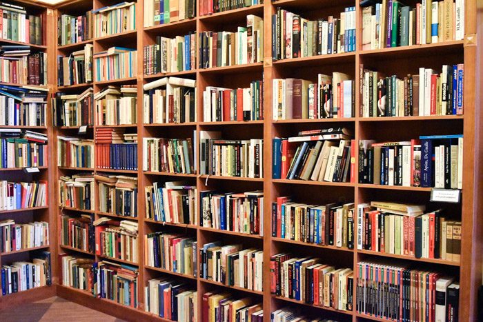 One corner of the interior of this bookshop, which contains large bookshelves holding a variety of secondhand books.