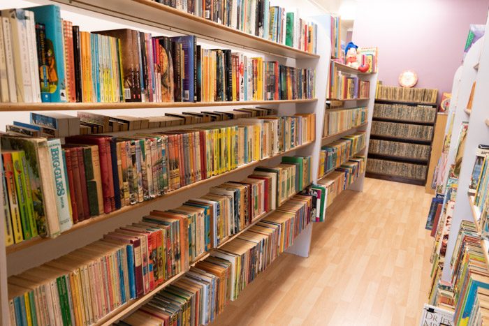 Picture of a lot of shelves with old children's books inside Spectrum Books.