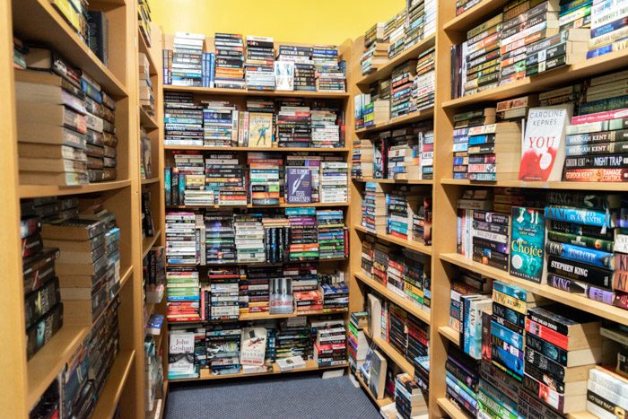 Picture of a shelving corner filled with mystery and thriller secondhand novels inside Spectrum Books.