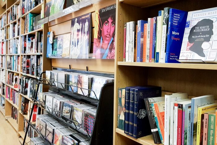 Closeup of a CD and book display inside Oxfam Books