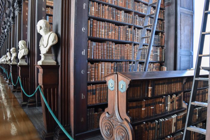 Close up of the wooden shelves in Trinity College library