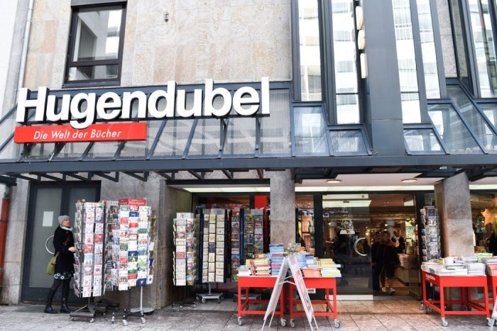 Front of Hugendubel bookshop with the shop name in large letters above the entrance