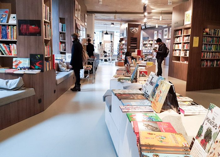 The interior of Ocelot bookshop, with several shoppers browsing the shelves.